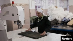 An inmate works in a sewing workshop inside female prison camp Number 22 in the Siberian city of Krasnoyarsk.