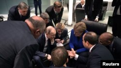 Канцлерът Ангела Меркел и руският президент Владимир Путин по време на конференцията за Либия в Берлин в неделя