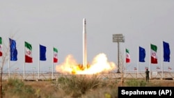 An Iranian rocket carrying a satellite is launched in 2020.