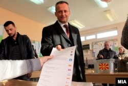 Parliament speaker Trajko Veljanoski votes at a polling station in Skopje.