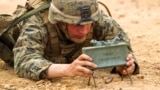 Thailand -- U.S. Marine Lance Cpl. Dominique A. Sparacino sets up an M18A1 claymore mine