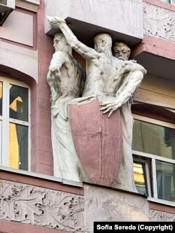 Figures on the facade of a historic building next to Kyiv's Independence Square, the Maidan