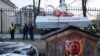 A mock coffin and a stuffed teddy bear with the inscription &quot;Russian soldier going home&quot; and&nbsp; &quot;Cargo 200&quot; is left at the front gates of the Russian Embassy in Warsaw on April 13.<br />
<br />
Cargo 200 is a military codeword used in the Soviet Union and the post-Soviet states to refer to the transportation of military fatalities.