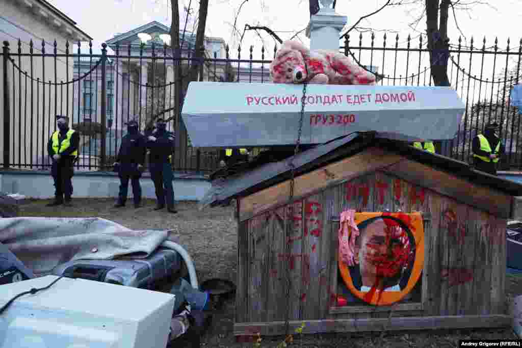 A mock coffin and a stuffed teddy bear with the inscription &quot;Russian soldier going home&quot; and&nbsp; &quot;Cargo 200&quot; is left at the front gates of the Russian Embassy in Warsaw on April 13. Cargo 200 is a military codeword used in the Soviet Union and the post-Soviet states to refer to the transportation of military fatalities.