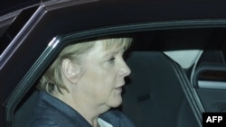 German Chancellor Angela Merkel arrives at the chancellery after a suspicious package was discovered there.