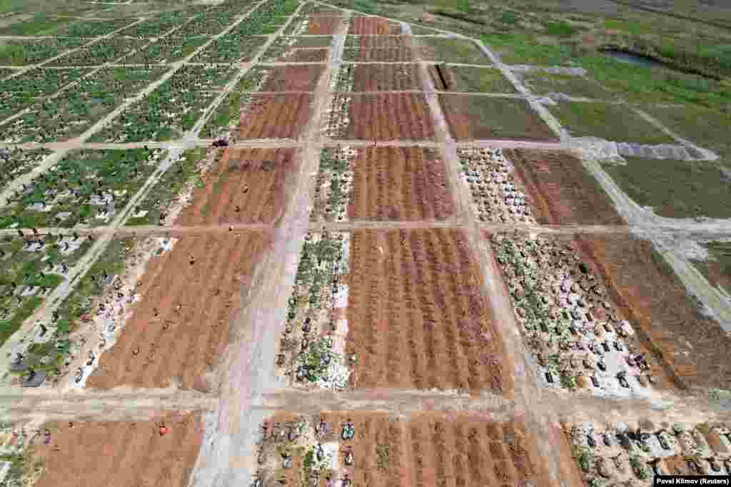 Rows of new graves in the Starokrymske cemetery photographed in May. The cemetery was massively expanded following the Russian takeover of the city, largely with graves marked only with a number. &nbsp;