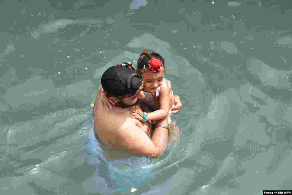 A Sikh pilgrim takes a holy dip at the Gurdwara Panja Sahib during the annual Baisakhi festival, a spring harvest festival for Sikhs and Hindus, in Hasan Abdal, Pakistan.