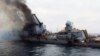 Moskva warship -- A photo shared on social media and widely believed to be the Moskva shows it on fire and listing badly. April 2022
