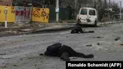 The bodies of civilians lie on a street in Bucha, northwest of Kyiv, on April 2 after Russian forces retreated.