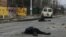 The bodies of men dressed in civilian clothes lie on a street in Bucha, northwest of Kyiv, on April 2.