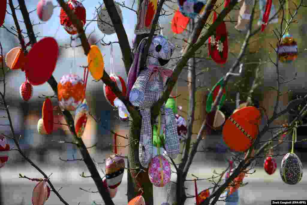 Painted Easter eggs and a child&#39;s bunny decorate a tree in the Easter Park of Hajduszoboszlo, Hungary, on April 12. The use of painted and decorated Easter eggs was first recorded in the 13th century. The egg is a symbol of the resurrection of Christ.