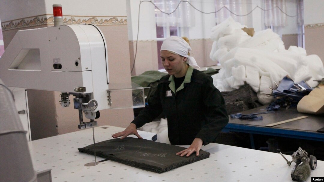 An inmate works in a sewing workshop inside female prison camp Number 22 in the Siberian city of Krasnoyarsk.