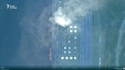 Нефтехранилище в порту Усть-Луга после предыдущих ударов.