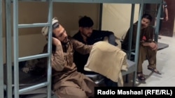 Afghans were held in detention in Lahore after being rounded up by Pakistani police.