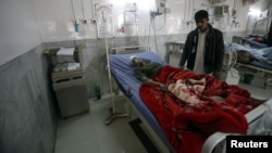 A badly injured Pakistani paramilitary soldier, who survived a shooting by Taliban militants, receives treatment at a hospital in Peshawar on December 30.