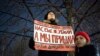 A woman at a Moscow rally in support of a widely anticipated domestic-violence bill on November 25.