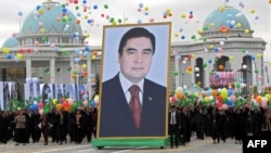 People carry a giant portrait of Berdymukhammedov during Independence Day celebrations in Ashgabat in 2009.
