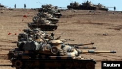 Turkish Army tanks take up position on the Turkish-Syrian border on October 6. 