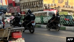 A photo obtained by AFP outside Iran reportedly shows Iranian police patrolling in the capital, Tehran, on October 8.