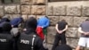 Those arrested by Belgrade police on October 10 are believed to be far-right hooligans who were protesting against the pan-European LGBT pride march that drew about 1,000 people to the center of the Serbian capital on September 17.