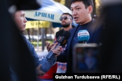 More than 100 demonstrators marched in Bishkek on October 14 in support of independent media and freedom of speech.