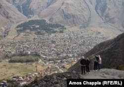 A group who said they were from Belarus look out over Stepantsminda on October 4.