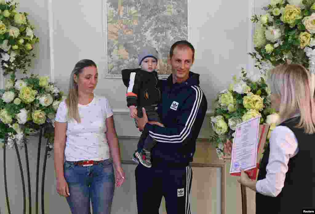 Drafted reservist Dmitry (last name not given) and his bride, Yevgenia, got married before his departure for a military base. UN Human Rights Council investigators have concluded that Russia committed war crimes in Ukraine, such as bombings of civilian areas, &quot;a large number of executions,&quot; &quot;consistent accounts of torture,&quot; and sexual violence that included the rape of children. &nbsp;