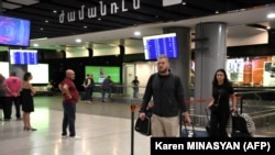 ARMENIA - Passengers arrive at Yerevan's Zvartnots airport on September 21, 2022. 