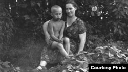 A young Vladimir Putin with his mother, Maria Ivanovna Putina.