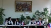 Members of an electoral commission wait for voters at a polling station in the Donetsk region during a referendum on the territory joining the Russian federation, which has been dismissed by Ukraine, Western governments, and the United Nations because the vote is illegal under international law. 