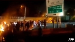 A video posted on social media on October 15 purportedly shows Iranian protesters gathered on a road leading to Evin prison, northwest of Tehran, where a fire broke out over the weekend amid reports of an uprising.
