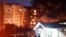 An apartment building catches fire after a Sukhoi Su-34 aircraft crashed into it on October 17.
