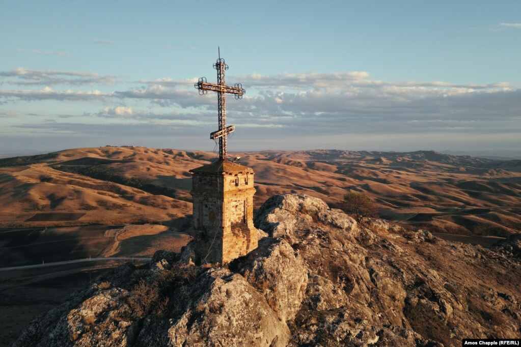 A mountaintop cross of the St. Elias Monastery, a famous landmark of Georgia's livestock migration route.