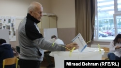 A man casts his vote at a polling station in Mostar on October 2.