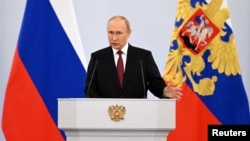 Russian President Vladimir Putin hinted at the use of nuclear weapons to defend the four regions his forces are trying to hold, saying Russia would defend them "by all the means we possess."