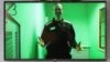 Aleksei Navalny is seen on a TV screen as he appears in a video link provided by the Russian Federal Penitentiary Service in a Moscow courtroom on October 18.