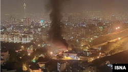 Flames and smoke rising from Tehran's Evin prison were widely visible in the evening on October 15 as nationwide anti-government protests triggered by the death of Mahsa Amini entered a fifth week. 