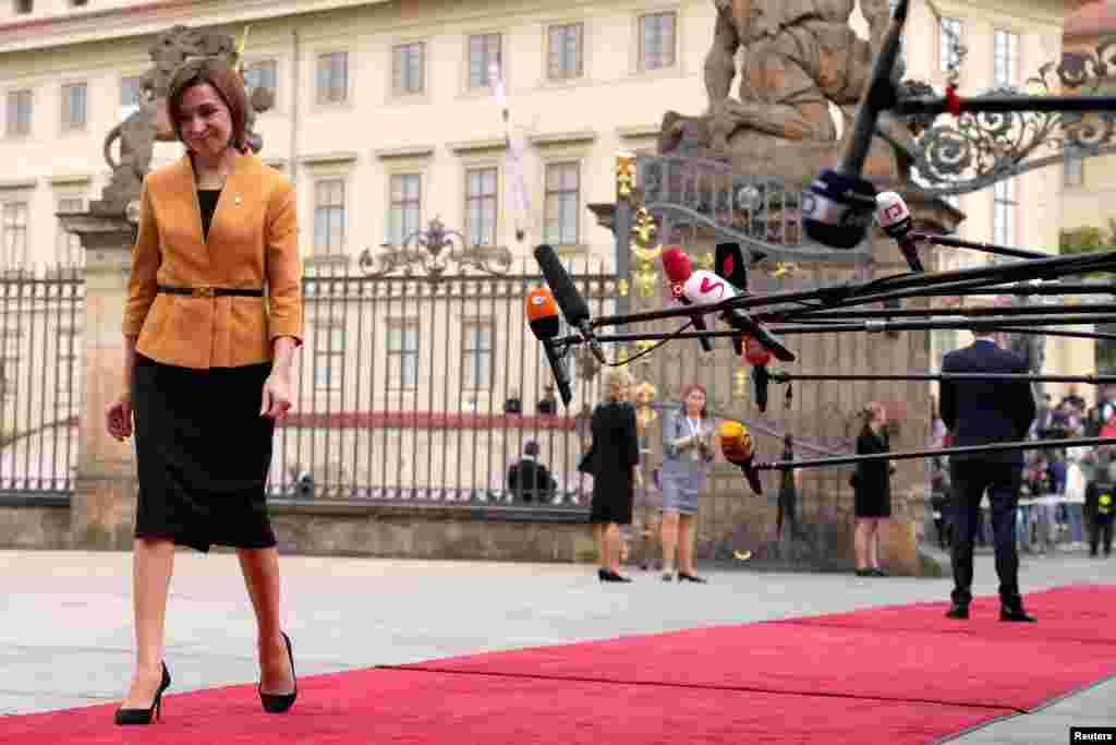 Moldovan President Maia Sandu arrives for a meeting of the European Political Community at Prague Castle on October 6. Sandu, the pro-European and Harvard-educated president of Moldova, has warned that with gas prices soaring as much as 600 percent in the past year, her country could potentially run out of gas and electricity this winter.