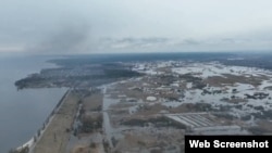 Залитая водой местность после подрыва дамбы в районе города Ирпень (Киевская область, Украина). Март 2022