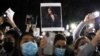 Protesters hold a vigil for 22-year-old Mahsa Amini in Sydney, Australia, on September 25. 
