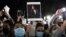Protesters hold a vigil for 22-year-old Mahsa Amini in Sydney, Australia, on September 25. 