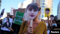 Protesters gather in support of Iranian women and against the death of Mahsa Amini in Madrid on October 1, said to be one of the 159 rallies around the world.