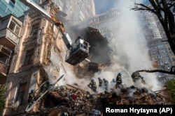 The aftermath of a kamikaze drone attack on an apartment block in Kyiv on October 17.