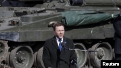 Estonian Defense Minister Margus Tsahkna speaks during an official ceremony welcoming the deployment of a multinational NATO battalion in Tapa earlier this month. 