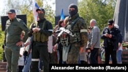 Weary Residents Look On In Occupied Mariupol As Russia Holds Victory Day Celebrations