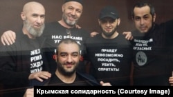 The five activists pose for a photo in court in Rostov-on-Don on May 12.