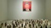 A portrait that mashes Chinese President Xi Jinping and Russian President Vladimir Putin is displayed in the DOX Center for Contemporary Art in Prague on May 12. Molotov cocktails in soy sauce bottles are on the floor.