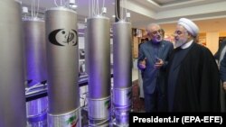 Iranian President Hassan Rohani (right) inspects a nuclear facility in Tehran earlier this year. 