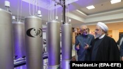 Iranian President Hassan Rohani (right) and the head of the country's atomic technology organisation Ali Akbar Salehi inspect a nuclear facility earlier this year. 