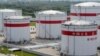 FILE PHOTO: Oil tanks are seen at a Sinopec plant in Hefei, Anhui province, China May 31, 2009. REUTERS/Jianan Yu/File Photo